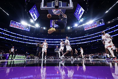 | Photo: AP/Jessie Alcheh : Los Angeles Lakers forward LeBron James dunks as additional players watch against the Phoenix Suns during the second half of an NBA basketball game in Los Angeles.