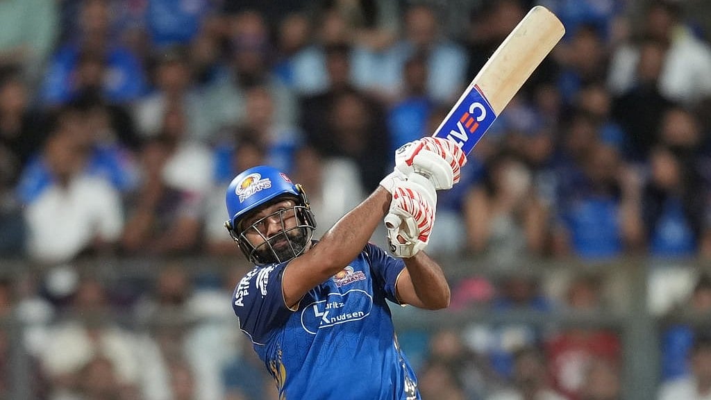 AP Photo/Rafiq Maqbool : Mumbai Indians Rohit Sharma plays a shot during the Indian Premier League cricket match between Mumbai Indians and Kolkata Knight Riders in Mumbai, India, Sunday, March 29, 2026. 