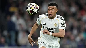 | Photo: AP/Bernat Armangue : Real Madrid's Kylian Mbappe watches the ball during the Champions League quarterfinal first leg soccer match between Real Madrid and Bayern Munich in Madrid, Spain.