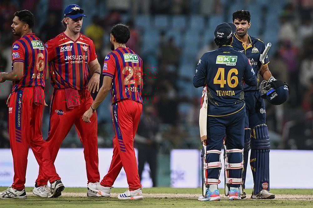 | Photo: AP/STR : Gujarat Titans Rahul Tewatia and Washington Sundar celebrate after winning the Indian Premier League cricket match between Gujarat Titans and Lucknow Super Giants in Lucknow, India.