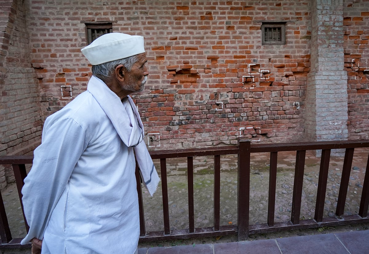 PTI : An eldery man looks at the bullet marks on a wall during a visit to the Jallianwala Bagh Martyrs Memorial on the eve of its massacre anniversary, in Amritsar, Sunday, April 12, 2026. The memorial at this site commemorates the unarmed Indians who were wounded or shot indiscriminately by the British troops on April 13, 1919 while participating in a peaceful public meeting, during the Indias freedom struggle.