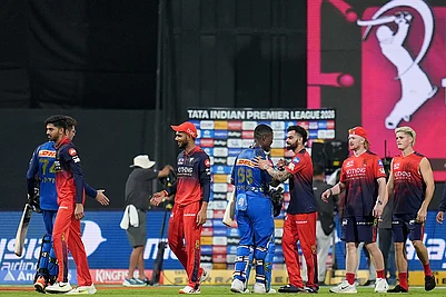 | Photo: PTI/Kunal Patil : Royal Challengers Bengalurus players being congratulated by Mumbai Indians Sherfane Rutherford and Mitchel Santner after winning the Indian Premier League (IPL) 2026 T20 cricket match, in Mumbai, Maharashtra.