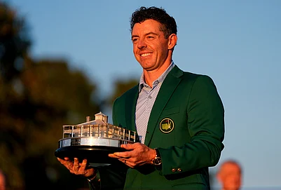| Photo: AP/Ashley Landis : Rory McIlroy, of Northern Ireland, holds the trophy after winning the Masters golf tournament at the Augusta National Golf Club in Augusta, Georgia.