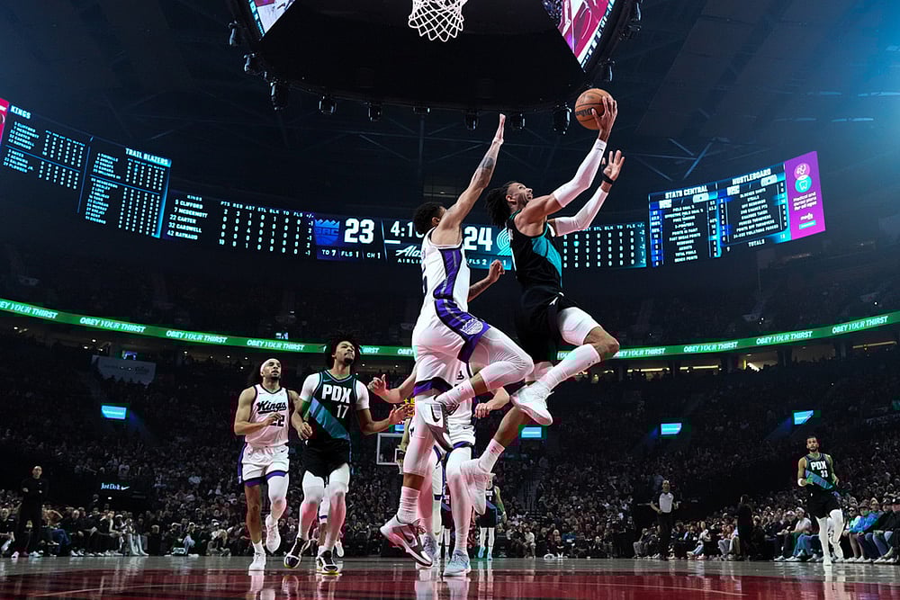 | Photo: AP/Jenny Kane : Portland Trail Blazers guard/forward Matisse Thybulle goes to the basket during the first half of an NBA basketball game against the Sacramento Kings in Portland, Ore. 