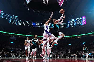 | Photo: AP/Jenny Kane : Portland Trail Blazers guard/forward Matisse Thybulle goes to the basket during the first half of an NBA basketball game against the Sacramento Kings in Portland, Ore.