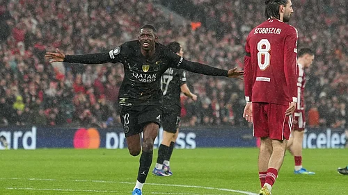 AP Photo/Jon Super : PSGs Ousmane Dembele celebrates after scoring during the Champions League quarterfinal second leg soccer match between Liverpool and Paris Saint-Germain in Liverpool, England, Tuesday, April 14, 2026.