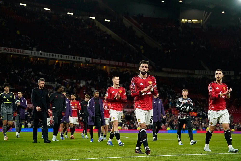 | Photo: AP/Dave Thompson : Manchester United players walk off the pitch after the Premiier League soccer match between Manchester United and Leeds in Manchester, England.