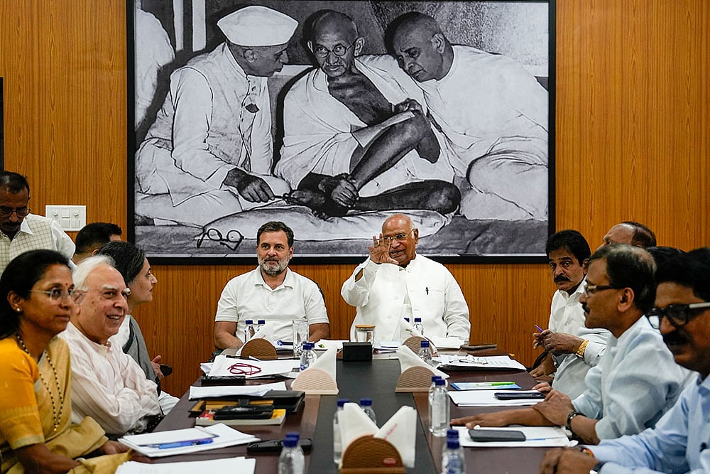 | Photo: PTI/Salman Ali : Congress President Mallikarjun Kharge and party leaders Rahul Gandhi and KC Venugopal, Shiv Sena (UBT) leader Sanjay Raut, NCP(SP) leader Supriya Sule, TMC leader Sagarika Ghose, DMK leader TR Baalu and other leaders during INDIA bloc meeting at Kharges residence, in New Delhi.