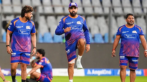 PTI/Kunal Patil : Mumbai Indians Rohit Sharma, centre, during a practice session on the eve of the Indian Premier League 2026 match against Punjab Kings, at Wankhede Stadium.