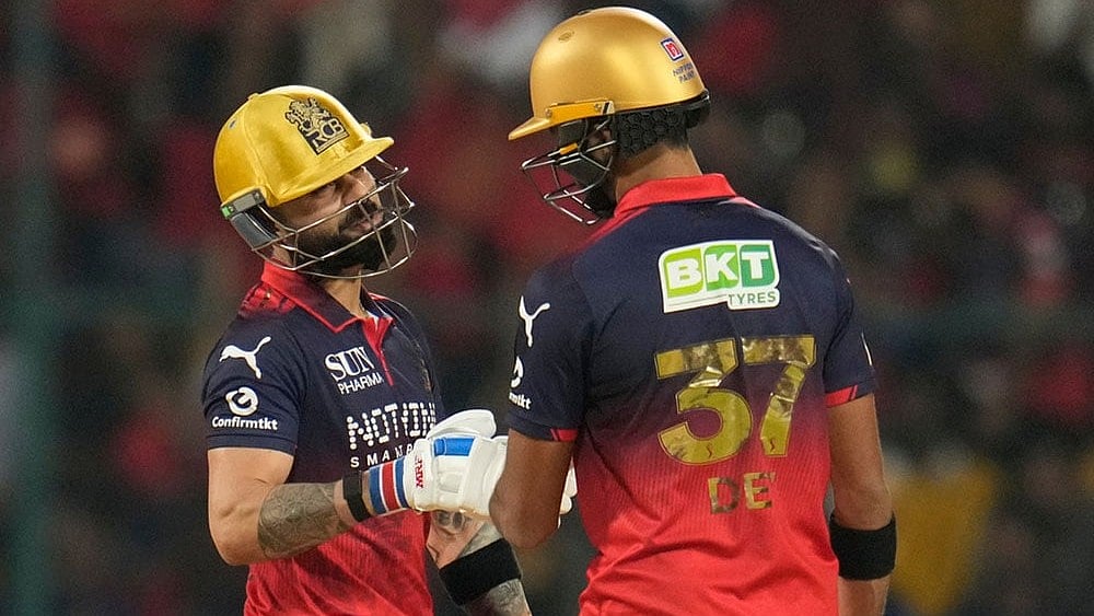 | Photo: AP/Aijaz Rahi : Royal Challengers Bengalurus Virat Kohli, left, celebrates after hits a boundary with Devdutt Padikkal during the Indian Premier League cricket match between Royal Challengers Bengaluru and Lucknow Super Giants in Bengaluru, India.