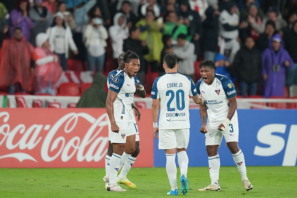 | Photo: AP/Dolores Ochoa : Jose Quintero of Ecuadors Liga Deportiva Universitaria, left, celebrates scoring his sides second goal against Brazils Mirassol during a Copa Libertadores Group G soccer match in Quito, Ecuador.