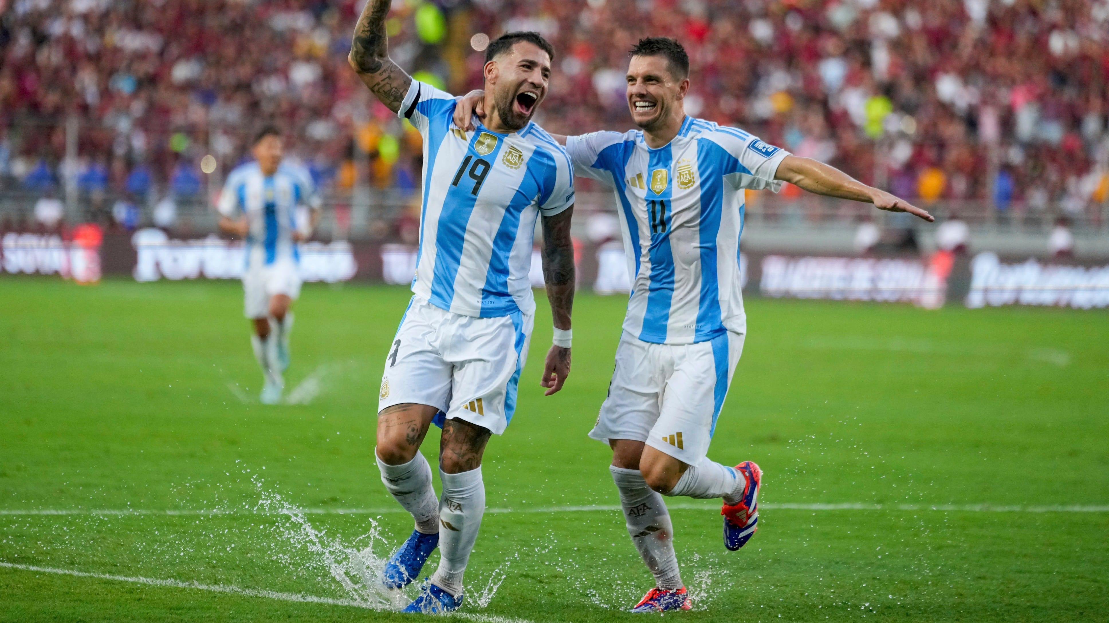 | Photo: AP/Ariana Cubillos : Argentina's Nicolas Otamendi (19, File) celebrates with Giovani Lo Celso after scoring his side's opening goal against Venezuela during a FIFA World Cup 2026 qualifying soccer match in Maturin, Venezuela, Thursday, Oct. 10, 2024. 