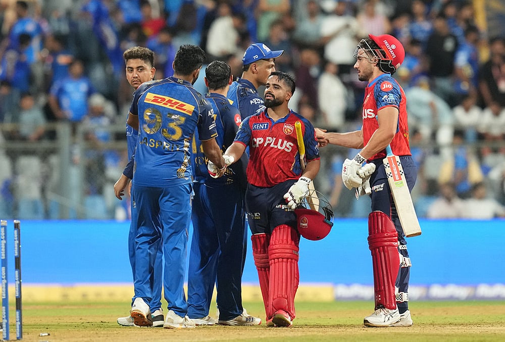 | Photo: AP/Rafiq Maqbool : Mumbai Indians Jasprit Bumrah congratulates Punjab Kings wicketkeeper Prabhsimran Singh after Punjab Kings won against Mumbai Indians during the Indian Premier League cricket match in Mumbai.