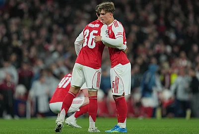 | Photo: AP/Kin Cheung : Arsenals Martin Zubimendi, left, and Max Dowman hug afterthe UEFA Champions League second leg quarterfinal soccer match between Arsenal and Sporting in London, England.