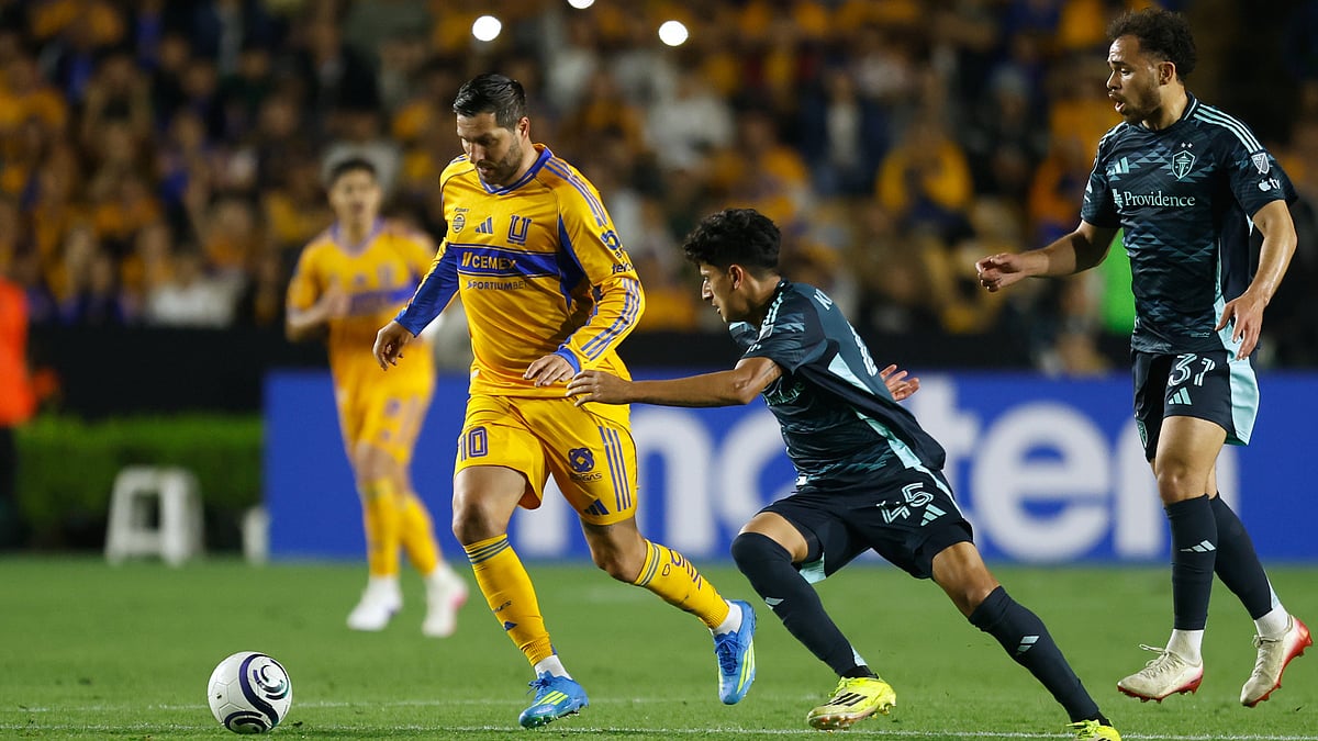 | Photo: AP/Jorge Mendoza : Andre-Pierre Gignac of Mexico's Tigres, left, is followed by Peter Kingston, center, and Hassani Dotson of the United States' Seattle Sounders during a CONCACAF Champions Cup quarterfinal first leg soccer match in Monterrey, Mexico, Wednesday, April 8, 2026. 