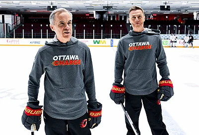 | Photo: Spencer Colby/The Canadian Press via AP : Canada Prime Minister Mark Carney, left, and President of Finland Alexander Stubb speak to reporters as they participate in an Ottawa Charge hockey practice session at TD Place in Ottawa.