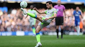 | Photo: AP/Ian Walton : Manchester City's Bernardo Silva clears the ball during the Premier League soccer match between Chelsea and Manchester City in London, Sunday, April 12, 2026.