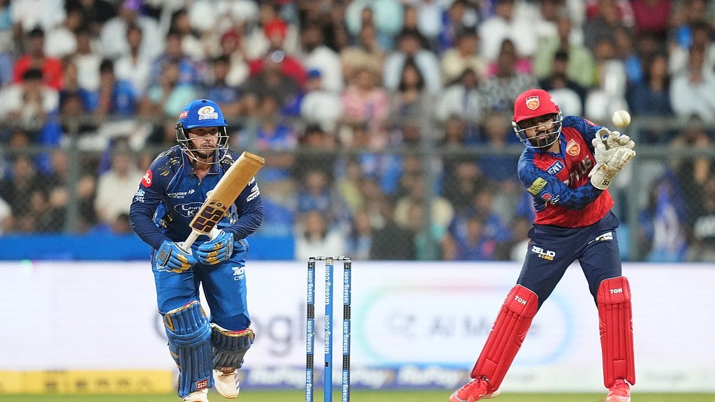 AP Photo/Rafiq Maqbool : Mumbai Indians wicketkeeper Quinton de Kock plays a shot during the Indian Premier League cricket match between Mumbai Indians and Punjab Kings in Mumbai, India, Thursday, April 16, 2026.