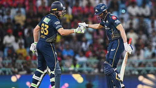 | Photo: AP/STR : Gujarat Titans Jos Buttler congratulates captain Shubman Gill after his fifty runs during the Indian Premier League cricket match between Gujarat Titans and Lucknow Super Giants in Lucknow, India.