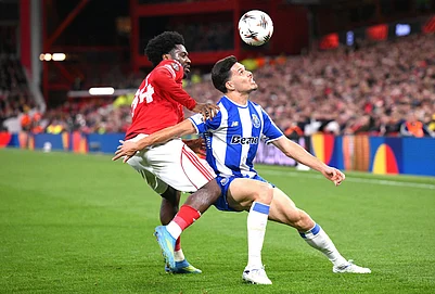 | Photo: Gary Oakley/PA via AP : Nottingham Forests Ola Aina, left, and Portos Francisco Moura in action during the Europa League quarterfinal second leg soccer match between Nottingham Forest and Porto in Nottingham, England.