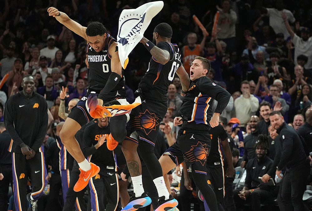 | Photo: AP/Ross D. Franklin : Phoenix Suns forward Royce ONeale, center, celebrate a 3-pointer against the Portland Trail Blazers with Suns forward Ryan Dunn (0) and Suns Collin Gillespie during the second half of an NBA play-in tournament basketball game, in Phoenix. 