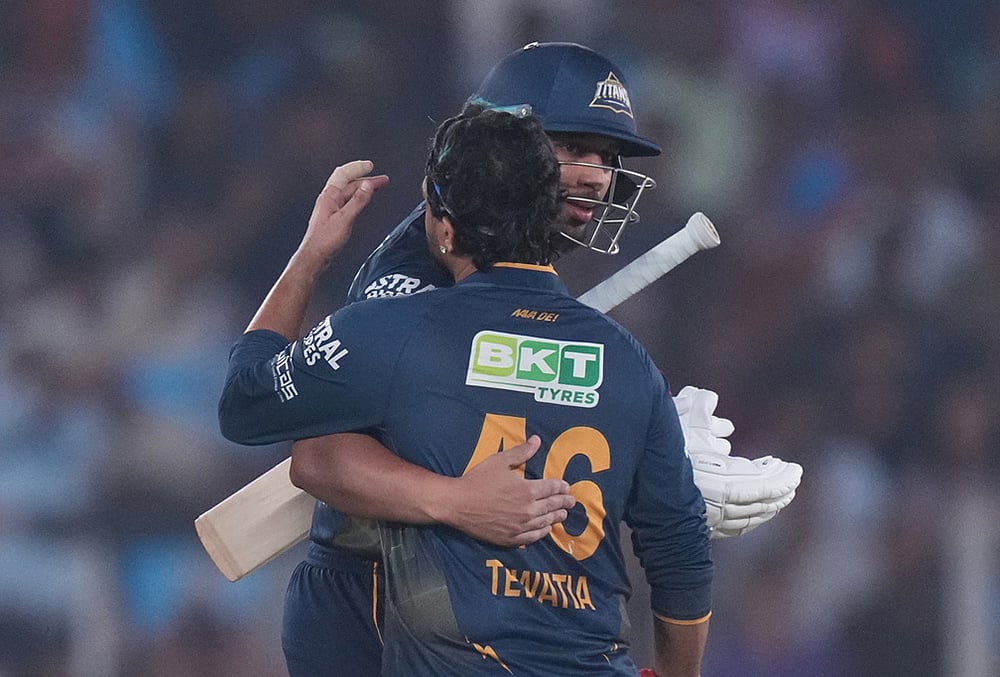 | Photo: AP/Ajit Solanki : Gujarat Titans Shahrukh Khan and Rahul Tewatia celebrate the win over Kolkata Knight Riders during the Indian Premier League cricket match in Ahmedabad.