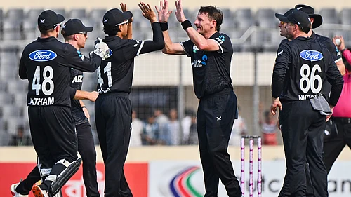 AP Photo : New Zealands Nathan Smith, celebrates with teammates the wicket of Bangladeshs Tanzid Hasan during the first one day international cricket match between Bangladesh and New Zealand.