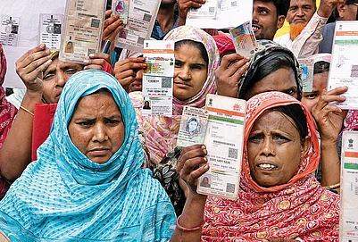 | Photo: Sandipan Chatterjee : The Missing Voters: Hasnara Khatoon (in blue), who lives in Harishchandrapur in Malda, says that despite having all the documents, five members of her family are missing from the list.