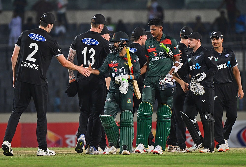 | Photo: AP/Mosaraf Hossain : New Zealands players shake hands with Bangladeshs players after winning the first one day international cricket match between Bangladesh and New Zealand in Mirpur, Bangladesh.