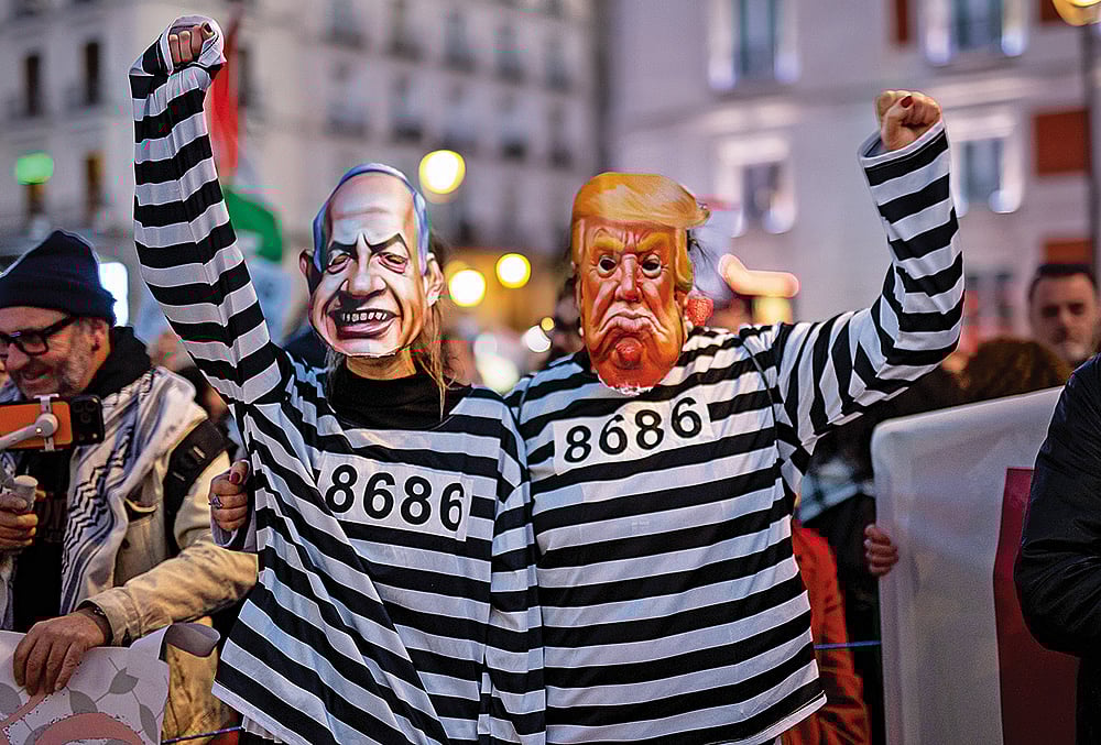 | Photo: IMAGO : Resistance and Unity: A couple dressed as Donald Trump and Benjamin Netanyahu are seen during a demonstration commemorating Palestinian Land Day on March 28, 2026