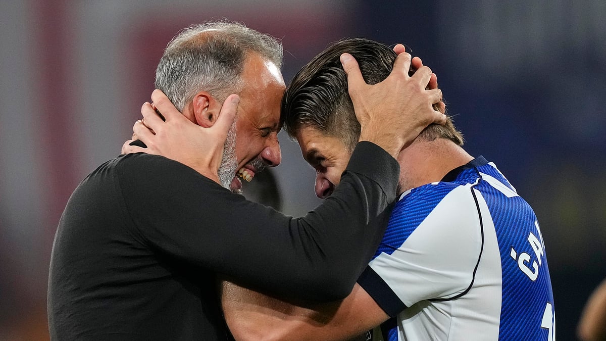 (AP Photo/Jose Breton) : Real Sociedad's head coach Pellegrino Matarazzo, right, celebrates with Duje Caleta-Car after winning the Copa del Rey final soccer match between Atletico Madrid and Real Sociedad in Seville, Spain, Saturday, April. 18, 2026.