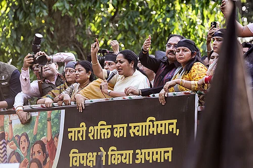 | Photo; PTI : Delhi Chief Minister Rekha Gupta joins women workers of the Bharatiya Janata Party (BJP) staging a protest near the residence of Leader of Opposition in the Lok Sabha Rahul Gandhi over the Constitution (131st Amendment) Bill on women’s reservation, in New Delhi.