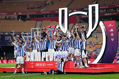 | Photo: AP/Jose Breton : Real Sociedads team players celebrate with the trophy after the Copa del Rey final soccer match between Atletico Madrid and Real Sociedad in Seville, Spain.