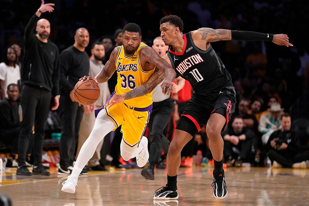 | Photo: AP/Mark J. Terrill : Los Angeles Lakers guard Marcus Smart, left, dribbles while under pressure from Houston Rockets forward Jabari Smith Jr. during the second half in Game 1 of a first-round NBA playoffs basketball series in Los Angeles.