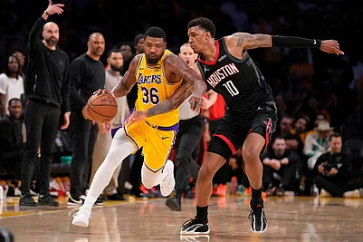 | Photo: AP/Mark J. Terrill : Los Angeles Lakers guard Marcus Smart, left, dribbles while under pressure from Houston Rockets forward Jabari Smith Jr. during the second half in Game 1 of a first-round NBA playoffs basketball series in Los Angeles.
