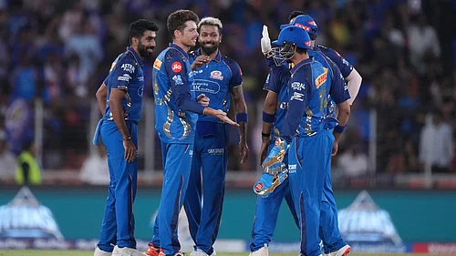 AP/Ajit Solanki : Mitchell Santner, second from left, celebrates with teammates the wicket of Washington Sundar during the Indian Premier League match between Gujarat Titans and Mumbai Indians in Ahmedabad.