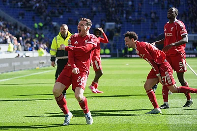 | Photo: AP/Ian Hodgson : Liverpools Andrew Robertson, front, and teammate celebrate with fans after the English Premier League soccer match between Everton and Liverpool in Liverpool, England.