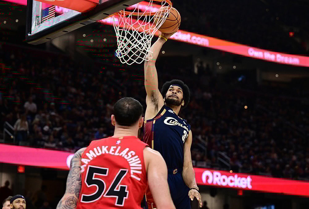 | Photo: AP/David Dermer : Cleveland Cavaliers center Jarrett Allen dunks over Toronto Raptors forward Sandro Mamukelashvili during the second half in Game 1 of a first-round NBA playoffs basketball series in Cleveland. 