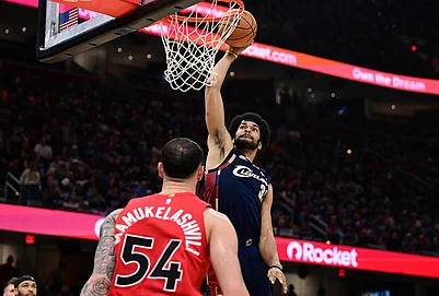 | Photo: AP/David Dermer : Cleveland Cavaliers center Jarrett Allen dunks over Toronto Raptors forward Sandro Mamukelashvili during the second half in Game 1 of a first-round NBA playoffs basketball series in Cleveland.