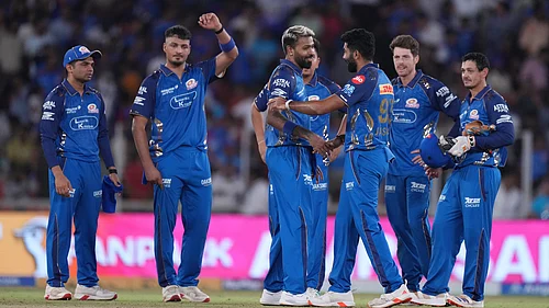AP Photo : Mumbai Indians players celebrates after winning the match the Indian Premier League cricket match against Gujarat Titans in Ahmedabad.
