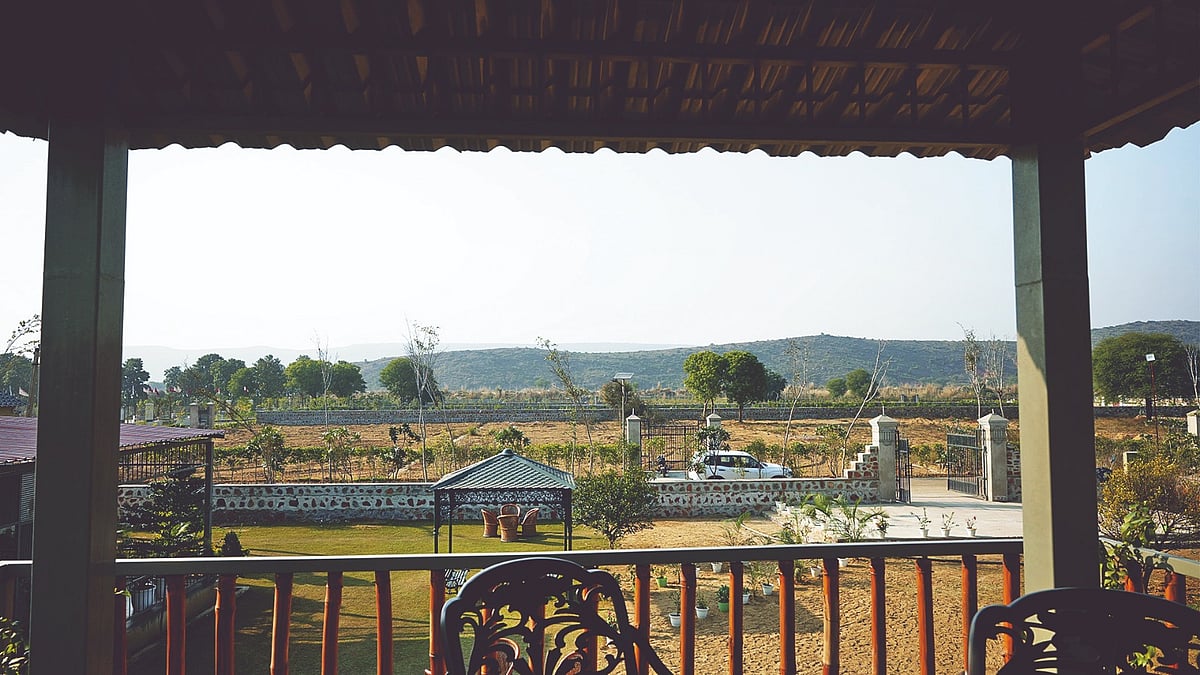 Green Step Farms by Ram Rattan Group in Naugaon, a nature-centric farmhouse community set amid the Aravalli landscape.