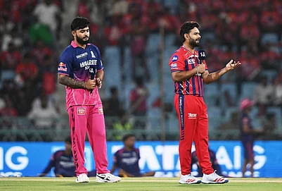 | Photo: AP : Rajasthan Royals captain Riyan Parag, left, looks on as Lucknow Super Giants captain Rishabh Pant talks to a commentator after losing the coin toss of the Indian Premier League cricket match between Lucknow Super Giants and Rajasthan Royals in Lucknow.