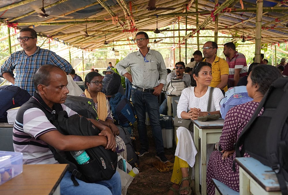 | Photo: Sandipan Chatterjee/OUTLOOK : In West Bengal’s Jhargram, poll preparations are in full swing as officials carry EVMs and VVPAT machines to their respective booths, beating the heat and the dust. The constituency which falls within the Jangalmahal area of the state, with its layered history, goes to polls on April 23.