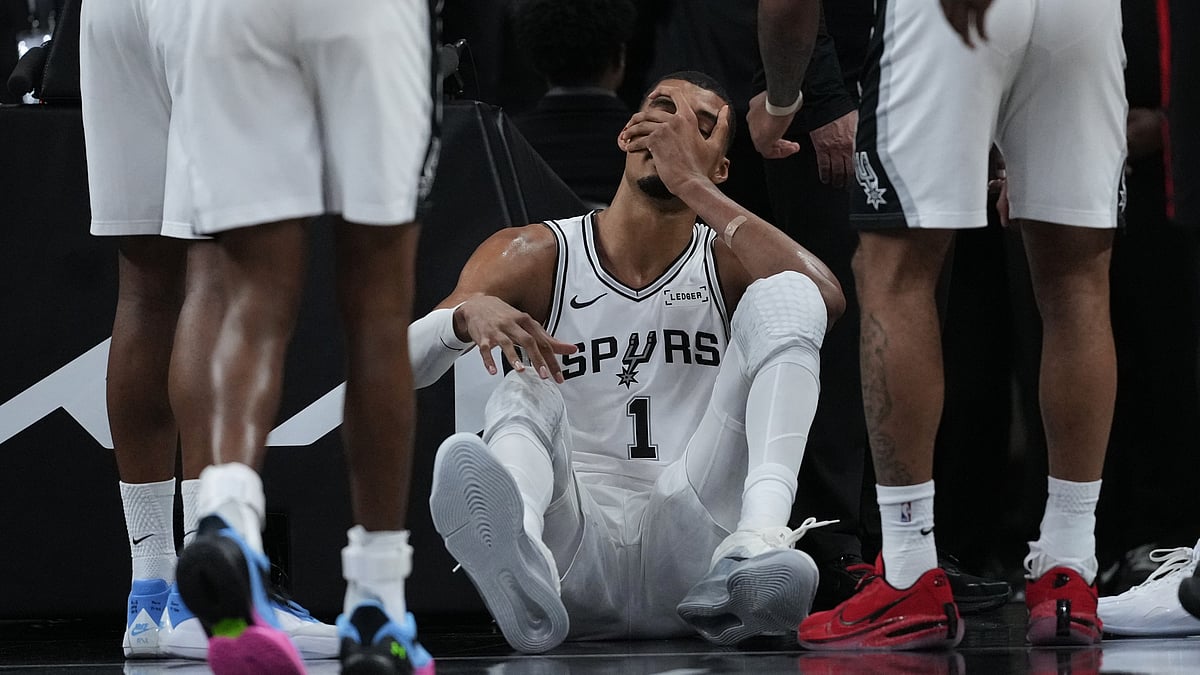 AP/Eric Gay : San Antonio Spurs forward Victor Wembanyama (1) sits on the court after a hard fall during the first half in Game 2 of a first-round NBA playoffs.