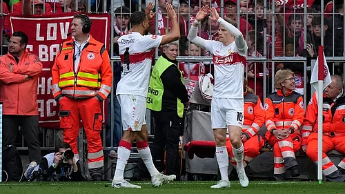Photo: AP/Matthias Schrader : Stuttgarts Josha Vagnoman, left, and Chris Fuehrich celebrate after scoring during a Bundesliga match against Bayern in Munich, Germany.