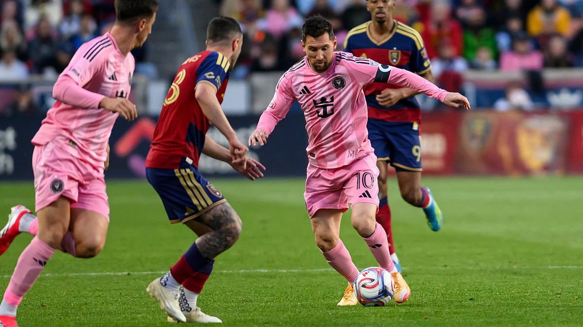 AP : Inter Miami midfielder Lionel Messi (10) controls the ball as he works through the defense of Real Salt Lake defender Alexandros Katranis, center left.