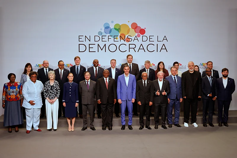 Joan Monfort : Spain's Prime Minister Pedro Sanchez, center, poses with attendees at the Meeting in Defence of Democracy summit in Barcelona, Spain, Saturday, April 18, 2026.