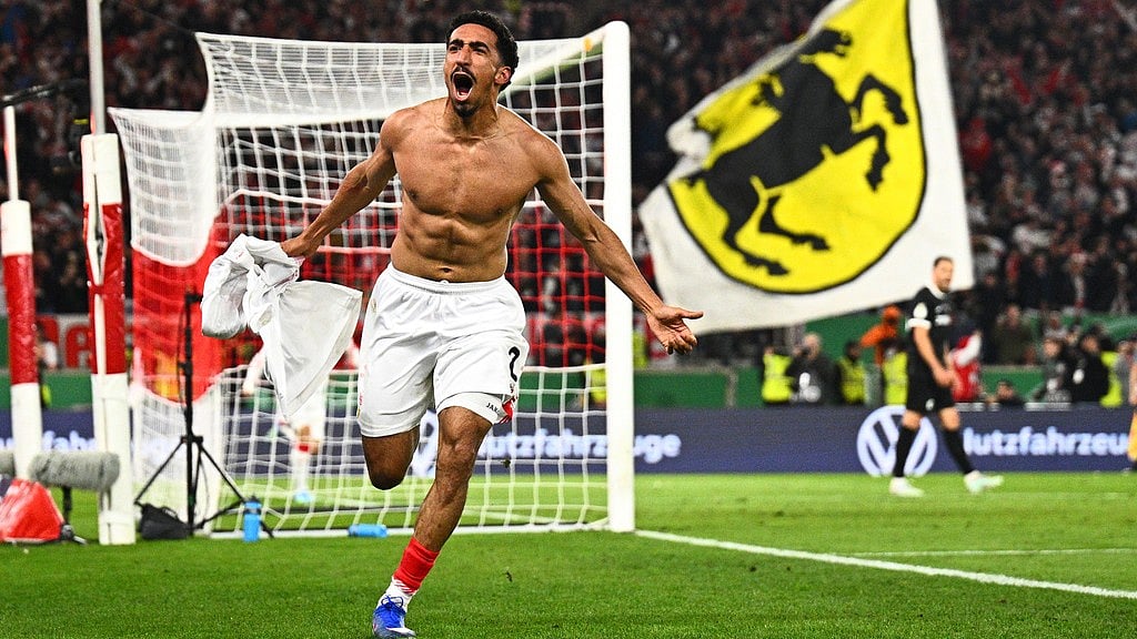 Photo: Tom Weller/dpa via AP : Tiago Tomas celebrates scoring the winning goal during the German Cup semi-final between VfB Stuttgart and SC Freiburg.