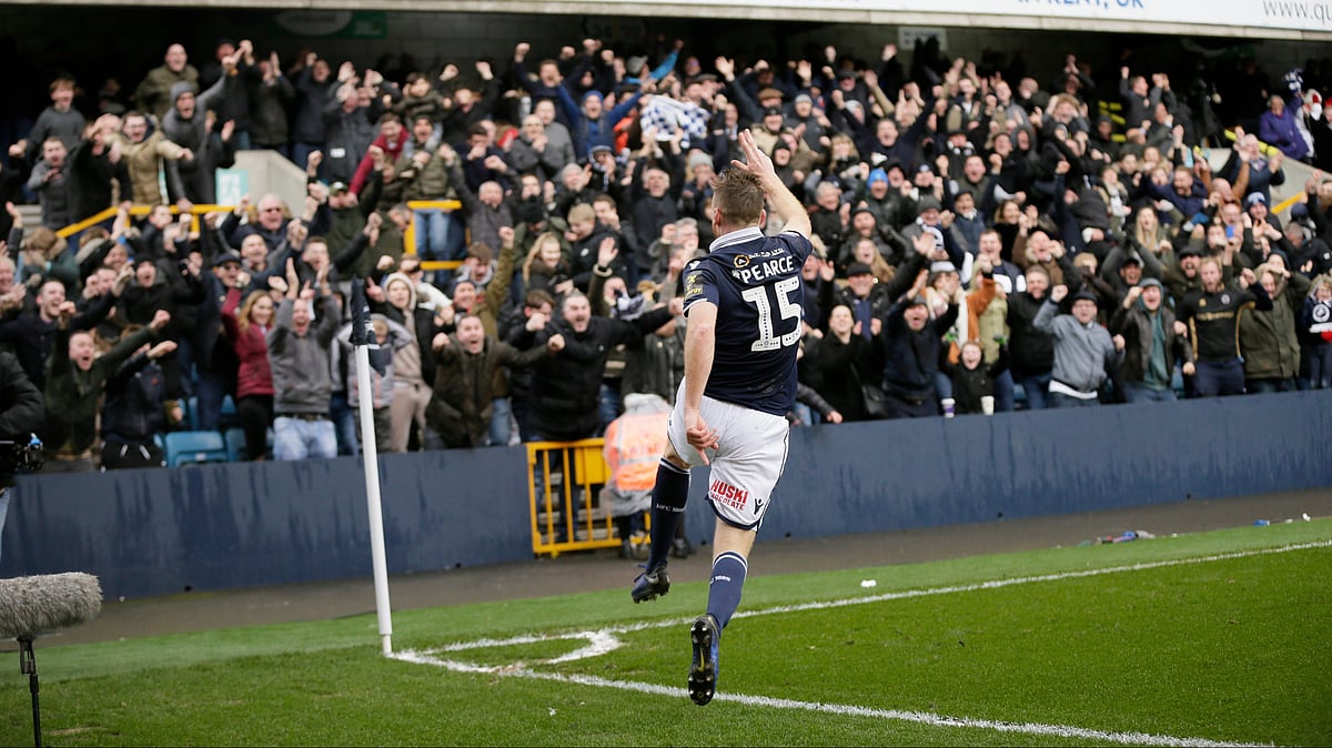 | Photo: AP/Tim Ireland : Millwall's Alex Pearce celebrates after scoring a goal during the English FA Cup quarterfinal between Millwall and Brighton & Hove Albion at The Den in London, Sunday March 17, 2018. 