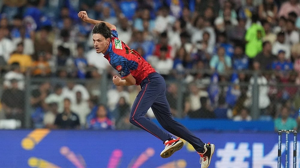 | Photo: AP/Rafiq Maqbool : Punjab Kings Marco Jansen bowls a delivery during the Indian Premier League cricket match between Mumbai Indians and Punjab Kings in Mumbai.